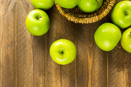 Organic Granny Smith apples on the table.の写真素材