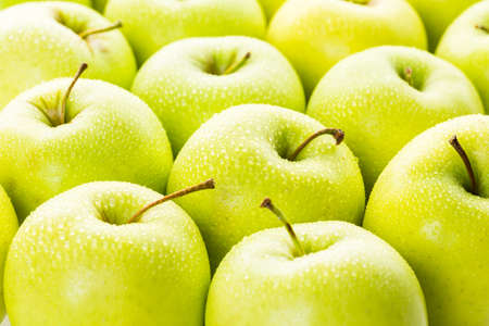 Close up of organic Golden Delicious apples.の写真素材
