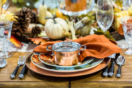 Table set with plates and silverware for Holiday dinner.の写真素材