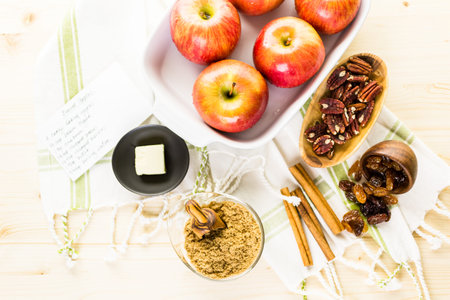Ingredients for preparing homemade baked apples from organic apples.の写真素材