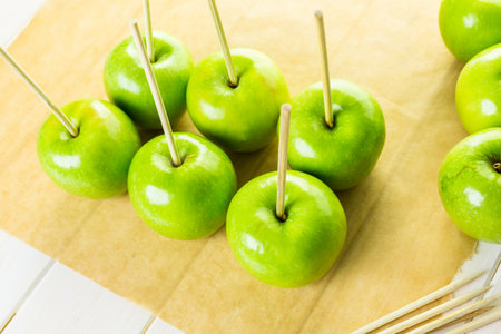 Ingredients for preparing homemade black candy apples.の写真素材