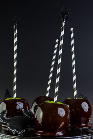 Homemade candy apples for Halloween party on the table.の写真素材