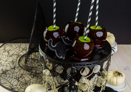 Homemade candy apples for Halloween party on the table.の写真素材