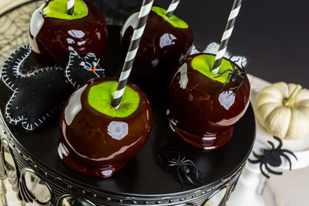 Homemade candy apples for Halloween party on the table.の写真素材