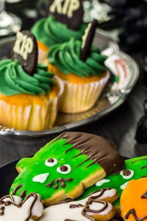Food table arrangement prepared for Halloween party.