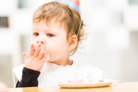 Toddler girl celebrating her second birthday.