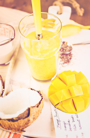 Freshly made mango banana smoothie with chia seeds.の写真素材