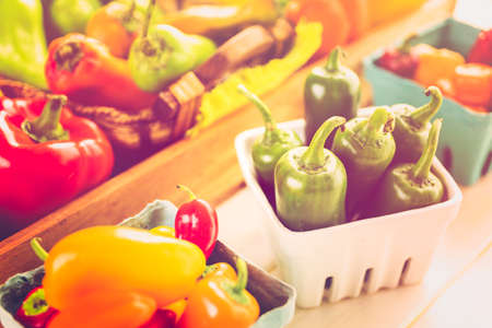 Variety of fresh organic peppers on the table.の写真素材