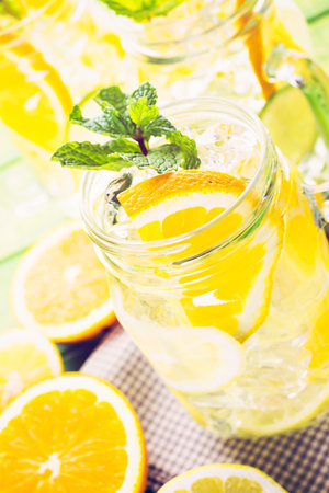 Infused water with fresh citrus fruits and ice.