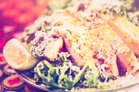 Arugula salad with grilled chicken in Italian restaurant.の写真素材
