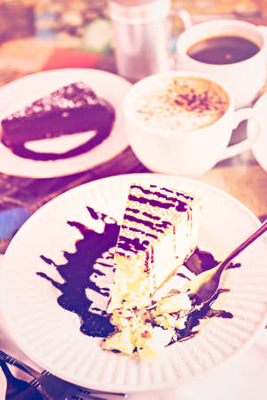 Fresh Italian Bailey's cheesecake with coffee on the table.の写真素材
