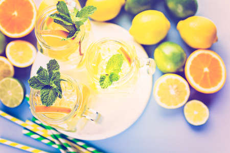 Infused water with fresh citrus fruits and ice.の写真素材