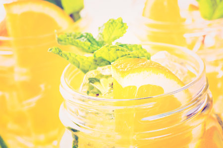 Infused water with fresh citrus fruits and ice.の写真素材