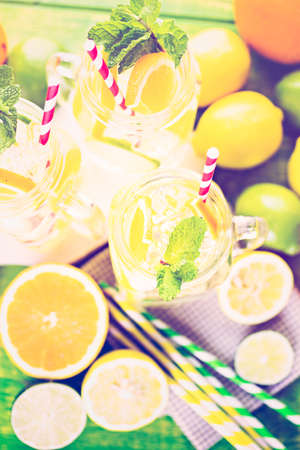 Infused water with fresh citrus fruits and ice.の写真素材