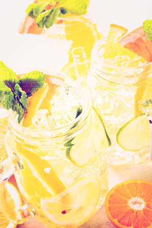 Infused water with fresh citrus fruits and ice.の写真素材