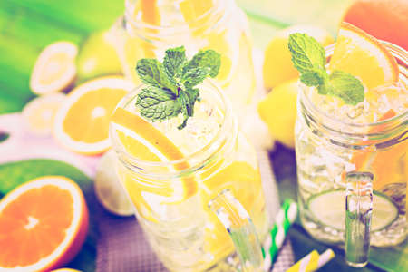 Infused water with fresh citrus fruits and ice.の写真素材