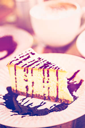 Fresh Italian Bailey's cheesecake with coffee on the table.の写真素材