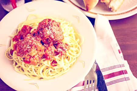 Spaghetti with meatballs on the plate in Italian restaurant.の写真素材