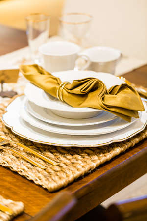 Table set with plates and silverware for Holiday dinner.の写真素材