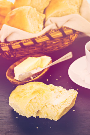 Freshly baked sourdough dinner rolls on black  background.