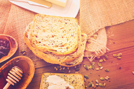 Fresh artisan sourdough seeded bread on the table.の写真素材