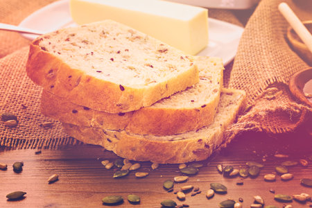 Fresh artisan sourdough seeded bread on the table.