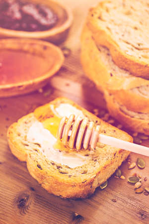 Fresh artisan sourdough seeded bread on the table.の写真素材