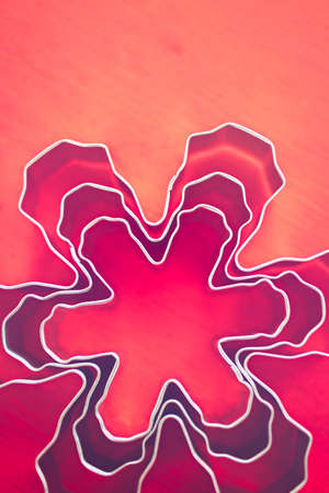Different size metal cookie cutters in shape of snow flakes.の写真素材