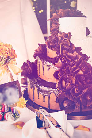Gourmet tiered wedding cake at wedding reception.の写真素材