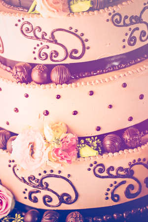 Gourmet tiered wedding cake at wedding reception.の写真素材