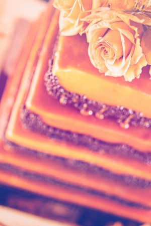 Gourmet tiered wedding cake as centerpiece at the wedding reception.の写真素材