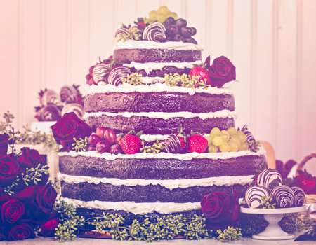 Gourmet tiered wedding cake at wedding reception.