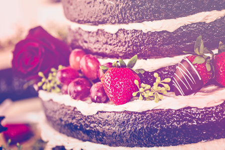 Gourmet tiered wedding cake at wedding reception.