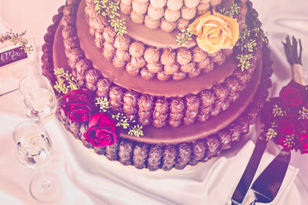 Gourmet tiered wedding cake as centerpiece at the wedding reception.の写真素材