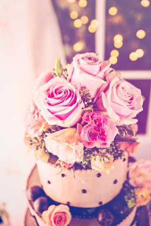 Gourmet tiered wedding cake at wedding reception.