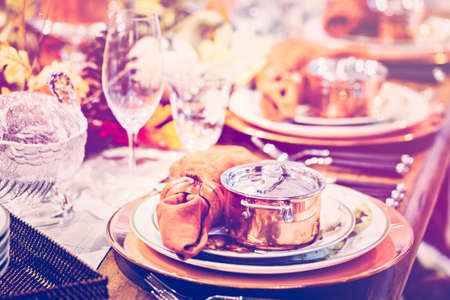 Table set with plates and silverware for Holiday dinner.の写真素材