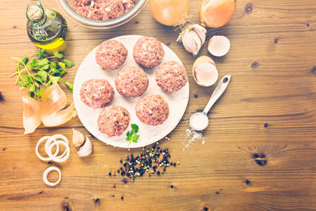 Cooking large homemade Italian meatballs for dinner.の写真素材