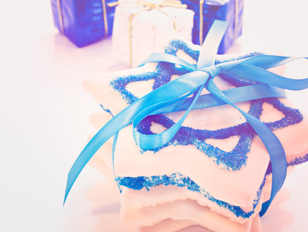 Gourmet cookies decorated with white icing for Hanukkah.