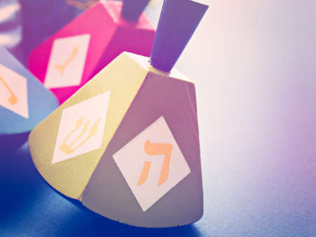 Colorful dreidels on blue background.の写真素材
