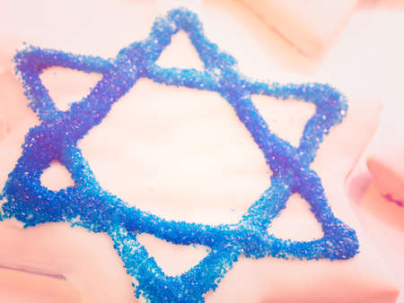 Gourmet cookies decorated with white icing for Hanukkah.の写真素材