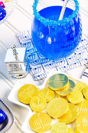 Table set with cocktails and chocolates to celebrate Hanukkah.の写真素材