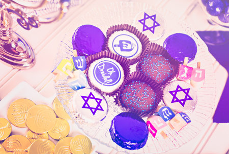 Table set with cocktails and chocolates to celebrate Hanukkah.の写真素材
