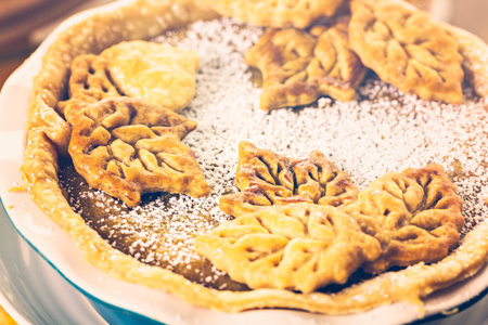 Homemade pumpkin pies with Autumn stamped leafs.