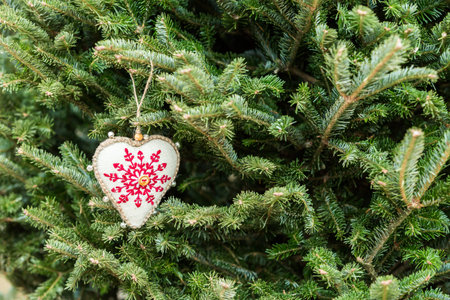 Hand crafted Christmas ornament on Christmas tree.の写真素材