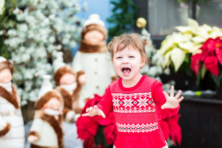 Cute toddler girl playing in Santa's house.の写真素材