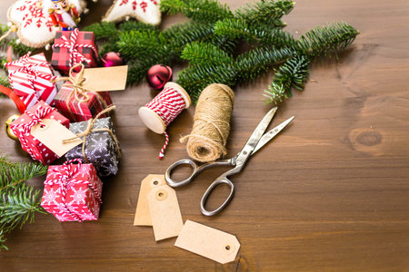 Wrapping assorted chocolates in small boxes for Christmas presents.の写真素材
