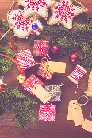 Wrapping assorted chocolates in small boxes for Christmas presents.