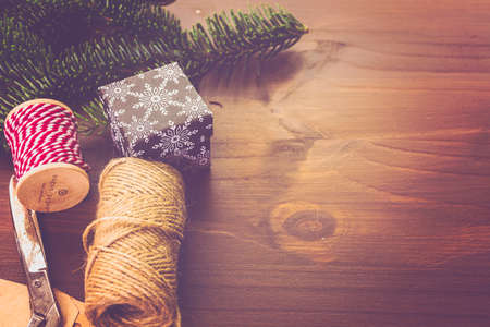 Wrapping assorted chocolates in small boxes for Christmas presents.の写真素材
