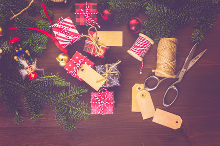 Wrapping assorted chocolates in small boxes for Christmas presents.の写真素材