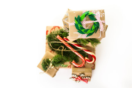Christmas gifts wrapped in brown paper with red ribbons.の写真素材